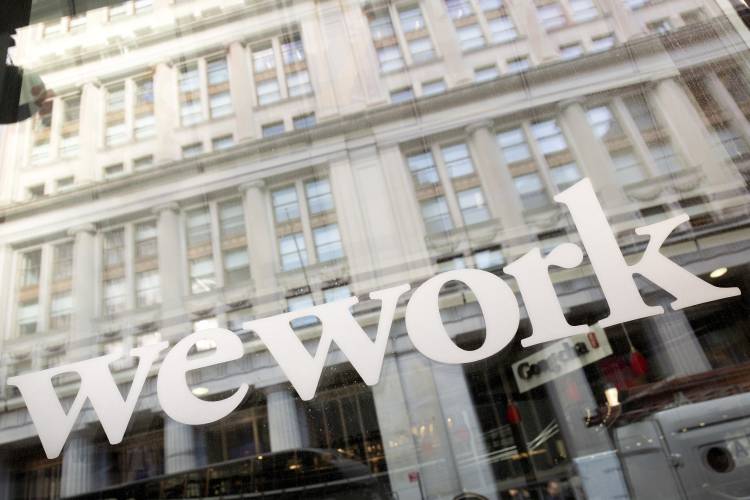 WeWork offices are shown, Thursday, Jan. 16, 2020 in New York. WeWork has filed for Chapter 11 bankruptcy protection, marking a stunning fall for the office sharing company once seen as a Wall Street darling that promised to upend the way people went to work around the world.