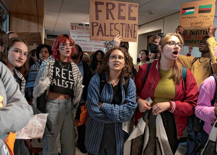 UMass students gather outside the chancellor’s office in the Whitmore Administration Building Wednesday to demand that the university cut ties with weapons manufacturers and condemn Israeli actions in Gaza. UMass police arrested 56 students and one faculty member after the building closed at 6 p.m. 