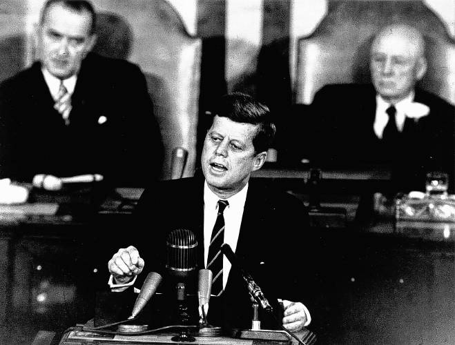 President John F. Kennedy in his historic message to a joint session of the Congress on May 25, 1961, declared, ” … I believe this nation should commit itself to achieving the goal, before this decade is out, of landing a man on the Moon and returning him safely to the Earth.” Kennedy was assassinated 60 years ago, on Nov. 22, 1963. Shown in the background of this file photo are, left, Vice President Lyndon B. Johnson, who succeeded Kennedy as president, and House Speaker Sam T. Rayburn.