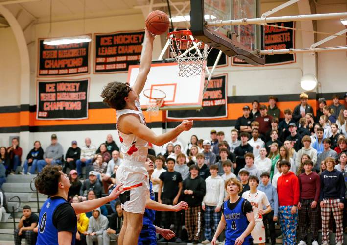 South Hadley’s Brady Currier (23) lays in a shot against Granby in the fourth quarter Wednesday night in South Hadley.