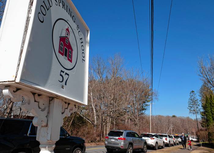 Parents line up to pick up their children at end of the school day at  Cold Spring School Wednesday afternoon, March 19,2025. 