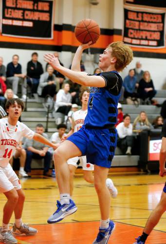 Granby’s Colin Murdock (4) puts up a shot against South Hadley in the second quarter Wednesday night in South Hadley.
