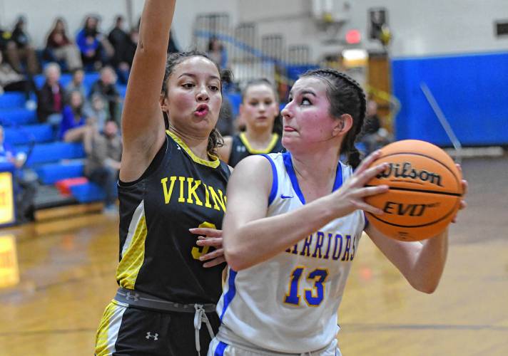 Mohawk Trail’s Riley Giard is defended by Smith Voc’s Jayanna Daniels in Buckland Thursday night.