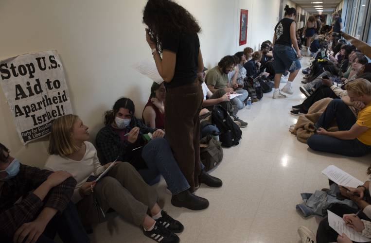UMass students gather outside the chancellor's office in Whitmore during a walkout and sit-in event on Oct. 25 to demand that the university cut ties with weapons manufacturers and condemn Israeli actions in Gaza.