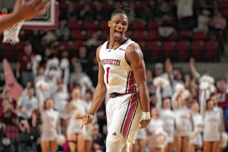 UMass freshman Jayden Ndjigue (11) celebrates after hitting a 3-pointer in the second half of the Minutemen’s 66-65 victory over George Mason on Saturday afternoon at the Mullins Center in Amherst.