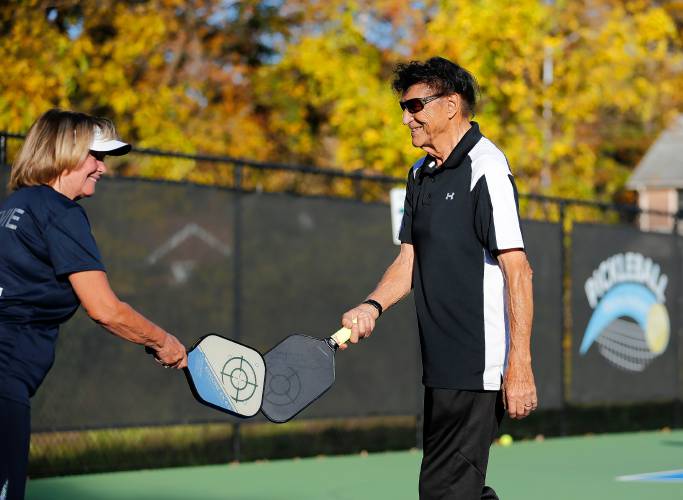 Hal Guillen and Evie Mikuszewski compete in the senior division of the 3-day pickleball tournament Friday at Buttery Brook Park in South Hadley.