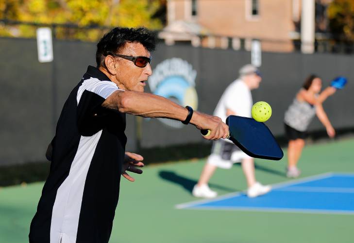 Hal Guillen, 88, competes in the senior division of a  pickleball tournament on a fall afternoon at Buttery Brook Park in South Hadley. These courts, like many in Hampshire County, are used constantly as demand for the sport continues to rise.